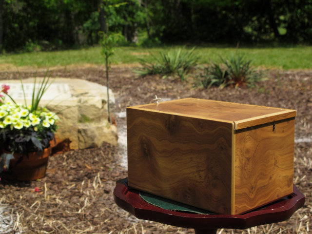 A wooden box on a small table.