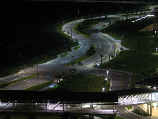 A street in the Orlando convention center area, empty, at night.