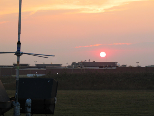 A sunset and a radio antenna.
