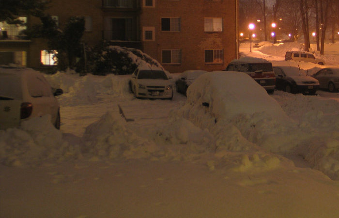 Chair in a parking spot, in the evening.